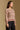 Model wearing the Saltwater Luxe Mimi Natural Sweater showing natural Fair Isle-inspired striped crewneck sweater, side view