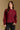 Model wearing the Saltwater Luxe Marri Burgundy Sweater with a softly textured knit, front view