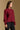 Model wearing the Saltwater Luxe Marri Burgundy Sweater with a softly textured knit, side view