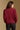 Model wearing the Saltwater Luxe Marri Burgundy Sweater with a softly textured knit, back view