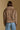 Model wearing the Saltwater Luxe Avelore Chai Jacket with an oversized shawl collar, back view