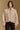 Model wearing the Saltwater Luxe Orian Natural Jacket with small allover motifs, front view