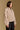 Model wearing the Saltwater Luxe Orian Natural Jacket with small allover motifs, side view