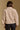 Model wearing the Saltwater Luxe Orian Natural Jacket with small allover motifs, back view