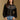 Model wearing the Saltwater Luxe Joss Black Sweater with a Fair Isle-inspired yoke, front view