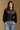 Model wearing the Saltwater Luxe Joss Black Sweater with a Fair Isle-inspired yoke, front view