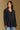 Model wearing the Saltwater Luxe Vionna Black Sweater with a textured knit, front view