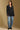 Model wearing the Saltwater Luxe Vionna Black Sweater with a textured knit, full-body view