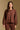 Model wearing the Saltwater Luxe Rhys Umber Sweater umber crewneck sweater, front view
