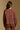 Model wearing the Saltwater Luxe Rhys Umber Sweater umber crewneck sweater, back view