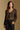 Model wearing the Saltwater Luxe Dovere Leopard Sweater leopard button-front cardigan sweater, front view
