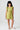 Front view of a young girl wearing the Saltwater Luxe  green Brammie Mini Dress on a white background