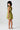 Back view of a young girl wearing the Saltwater Luxe  green Brammie Mini Dress on a white background