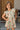 Girl model wearing Saltwater Luxe Littles Brammie Girls Mini Dress in Blue Floral standing outdoors near doorway