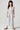 Girls Lucca Jumper front studio view with blue and ivory stripe pattern, flutter sleeves and relaxed wide-leg fit