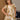 Girl wearing the Allima Mini Dress in a cream floral print featuring puff sleeves, a square neckline, and a tiered skirt