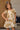Girl wearing the Allima Mini Dress in a cream floral print featuring puff sleeves, a square neckline, and a tiered skirt