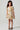 Front view of the Girls Allima Mini Dress featuring a cream floral print, puff sleeves, and a relaxed tiered fit