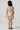 Back view of the Girls Allima Mini Dress featuring a smocked back bodice, puff sleeves, and tiered skirt detail