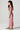 Girl model wearing Saltwater Luxe Littles Lucca Girls Jumper in Cocoa Stripe side full body studio view