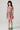 Front view of the Girls Sophia Mini Dress featuring a pink floral print, smocked bodice, flutter sleeves, and tiered lace-trim skirt
