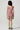 Back view of the Girls Sophia Mini Dress showcasing the fully smocked bodice, flutter sleeves, and floral tiered skirt with lace trim