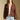 Front view of a woman wearing the Saltwater Luxe Aden Sweater and jeans on a neutral background with hands at sides