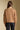Back view of a woman wearing the Saltwater Luxe Aven Sweater on a neutral background with arms at sides