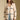 Front view of a woman wearing the Saltwater Luxe Birdy Sweater on a neutral background with hands at sides