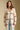 Front view of a woman wearing the Saltwater Luxe Birdy Sweater on a neutral background with hands at sides