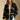Front view of a woman wearing the Saltwater Luxe Birdy Sweater on a neutral background with hands at sides