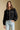 Front view of a woman wearing the Saltwater Luxe Jene Jacket on a neutral background with bluejeans