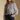 Front view of a woman wearing the Saltwater Luxe Brielle Top on a neutral background with black pants