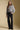 A full body front view of a woman wearing the Saltwater Luxe Brielle Top on a neutral background