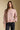 Front view of a woman wearing the Saltwater Luxe Camron Sweater on a neutral background with hand in pocket
