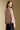 Back view of a woman wearing the Saltwater Luxe Camron Sweater on a neutral background in jeans