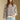Front view of a woman wearing the Saltwater Luxe Camron Sweater on a neutral background with hand in pocket of jeans