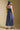 Back view of a woman wearing the Salt Water Luxe Charlize Midi Dress on a neutral background
