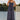 Front view of a woman wearing the Salt Water Luxe Charlize Midi Dress on a dock in front of water