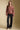 A full body front view of a woman wearing the Saltwater Luxe Vincent Sweater on a neutral background