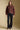 A full body front view of a woman wearing the Saltwater Luxe Deeda Jacket on a neutral background