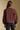 Back view of a woman wearing the Saltwater Luxe Deeda Jacket on a neutral background with hands at her sides