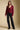 A full body front view of a woman wearing the Saltwater Luxe Dovere Sweater on a neutral background