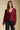 Front view of a woman wearing the Saltwater Luxe Dovere Sweater on a neutral background with black jeans