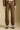 Front view of a woman wearing the Saltwater Luxe Elana Pant on a neutral background with arms at sides