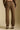 Back view of a woman wearing the Saltwater Luxe Elana Pant on a neutral background