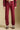 Front view of a woman wearing the Saltwater Luxe Elara Pant on a neutral background with shoes