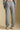 Back view of a woman wearing the Saltwater Luxe Heather Grey Pant on a neutral background