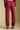 Back view of a woman wearing the Saltwater Luxe Elara Pant on a neutral background