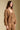 Front view of a woman wearing the Saltwater Luxe Ellyn Sweater on a neutral background with arms at sides and pants
